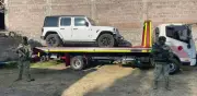 Autoridades aseguran autos de lujo y armas del CJNG en operativo en Tlaxcala