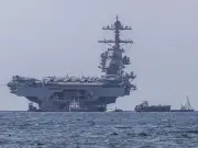 Reino Unido retira personal de Irán por seguridad mientras EE.UU. despliega portaaviones