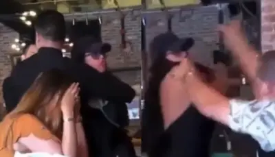 Esposa enfurecida golpea a su marido y a su amante en restaurante dominicano