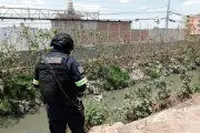 Hallan cadáver en canal de Tultepec, Estado de México