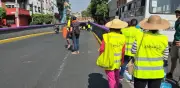 Ciclistas pintan carril seguro en Calzada de Tlalpan, CDMX