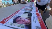 Rostros de desaparecidos llenan muros en Jalisco en lucha contra el olvido