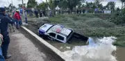 Hallan tres mujeres muertas en patrulla arrastrada por río Atoyac